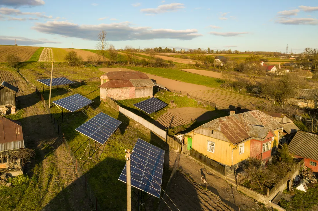 aerial-top-down-view-solar-panels-green-rural-village-yard
