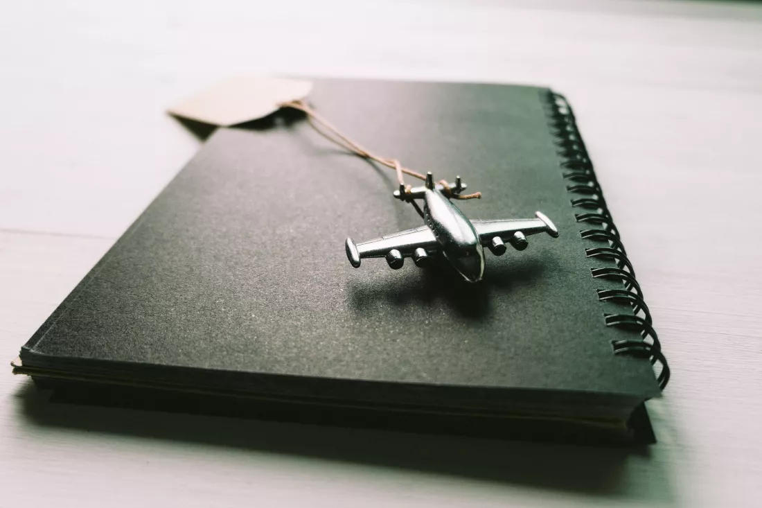 toy-airplane-spiral-notebook-desk