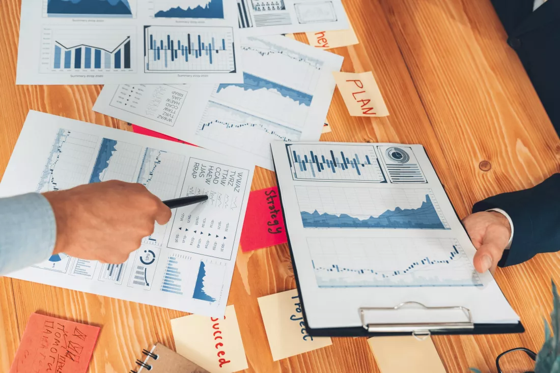 analyst-team-office-analyzing-financial-data-analysis-papers-entity