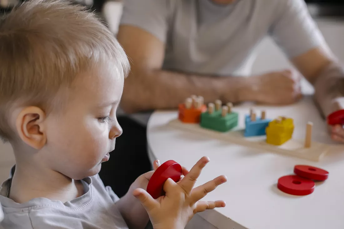 close-up-boy-playing-with-toy-blocks